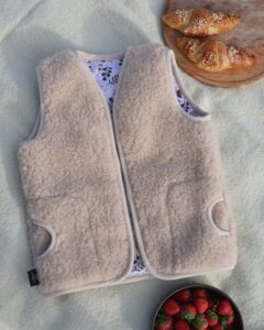 Vaikiška merino vilnos kreminė liemenė VORA, WoolLando